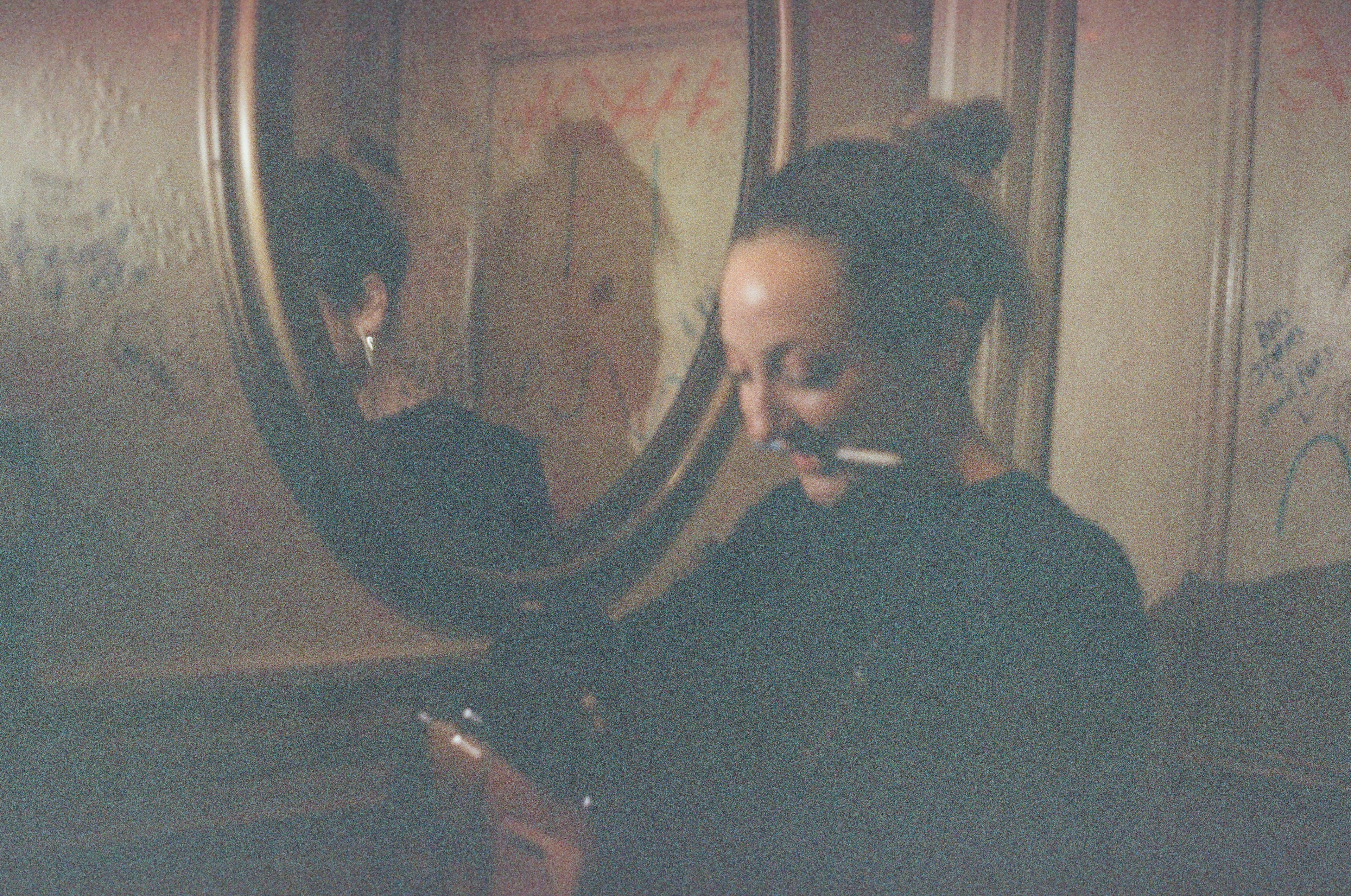 Woman in bathroom mirror